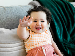 A baby waving