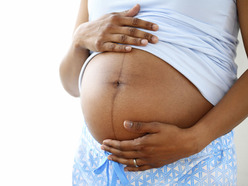 pregnant woman's belly with linea nigra