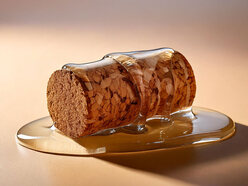A cork covered in a clear, thick liquid